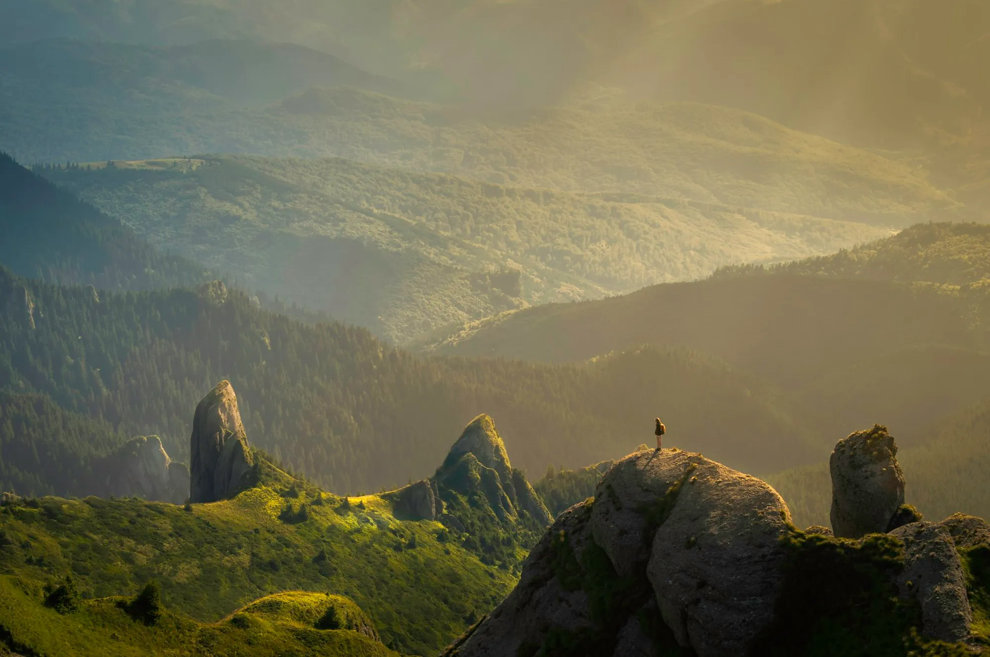 Misty mountain ridges in golden light